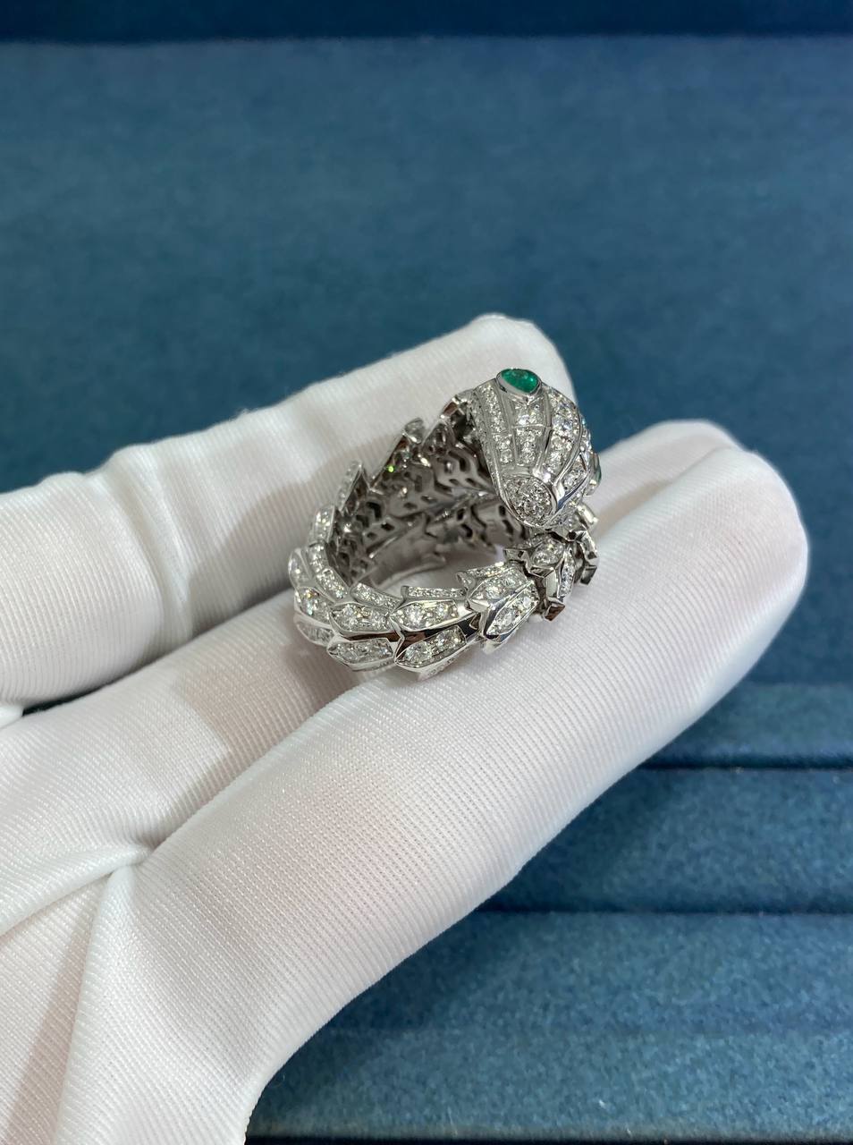 Serpent diamond ring with emeralds