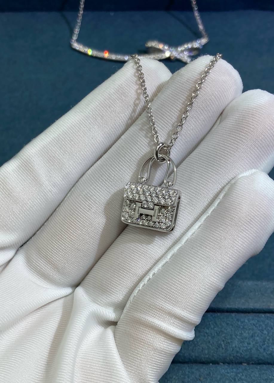 Amulets pendant with pavé diamonds