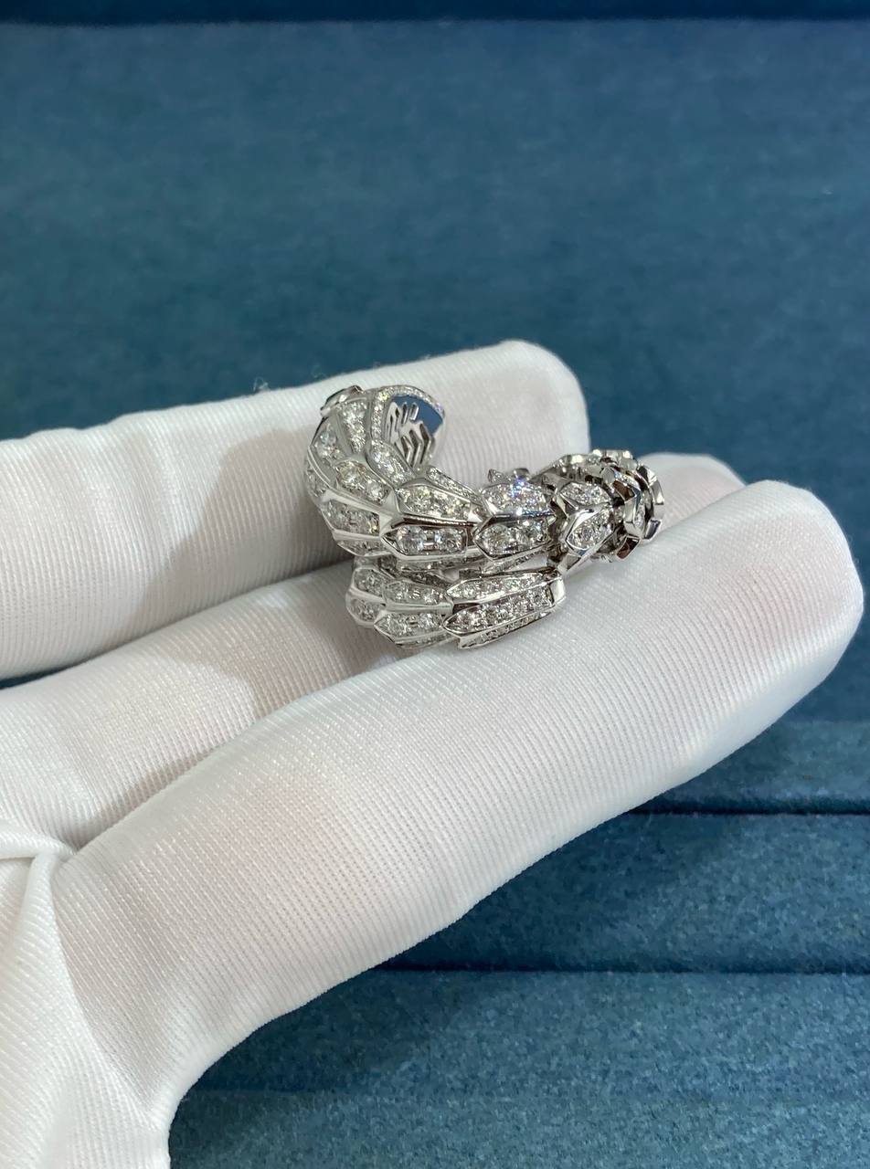 Serpent diamond ring with emeralds