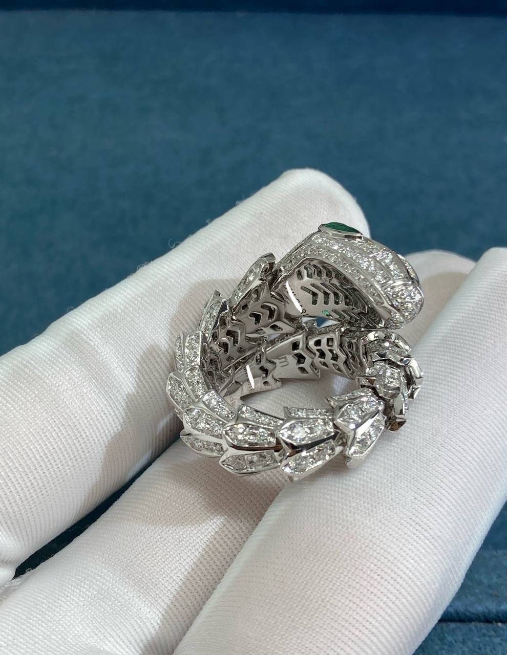 Serpent diamond ring with emeralds