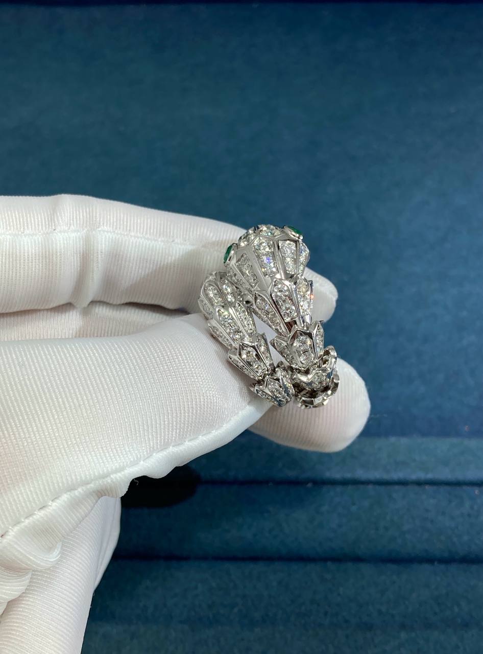 Serpent diamond ring with emeralds